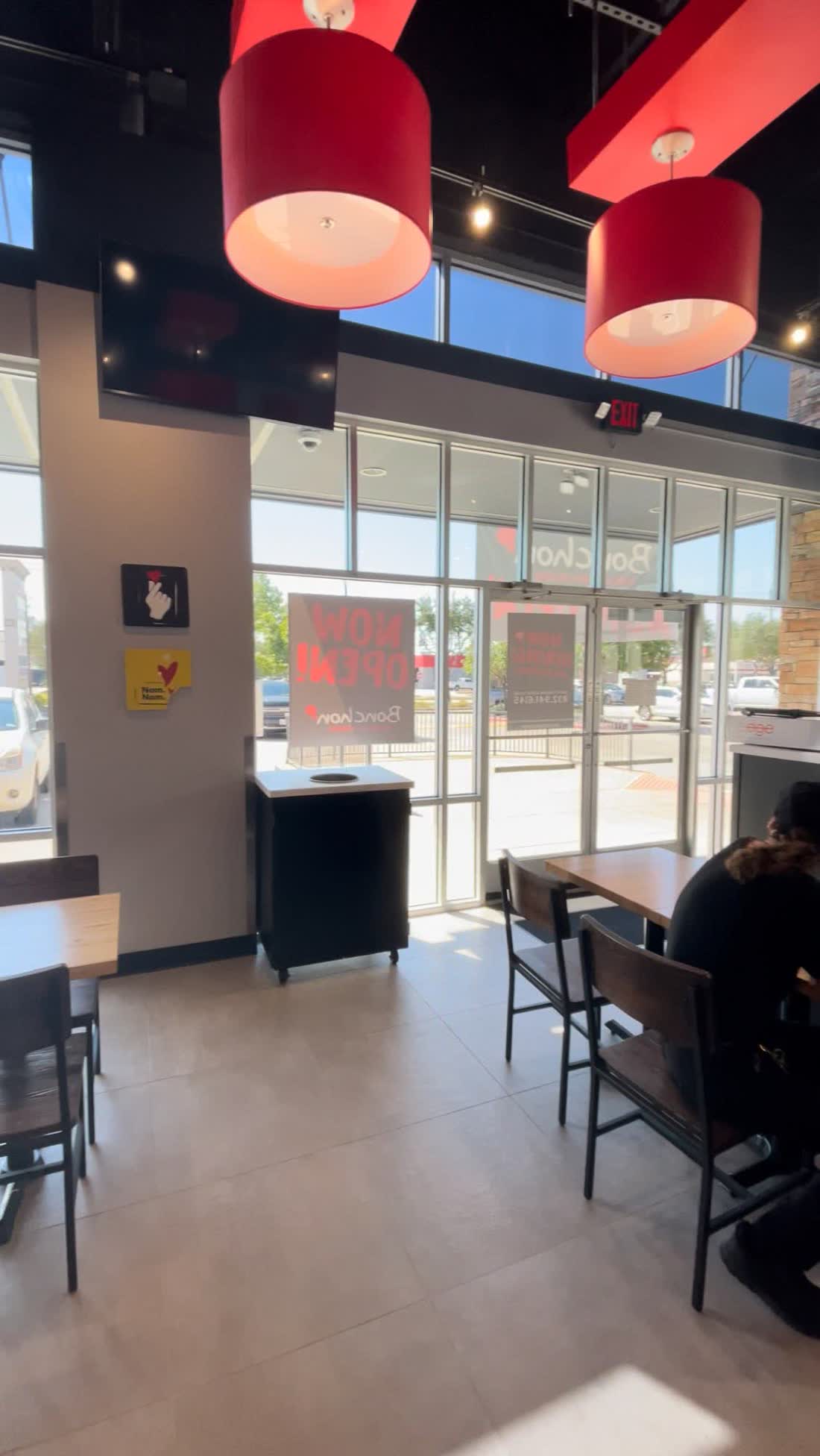 Storefront glass seen from inside a restaurant