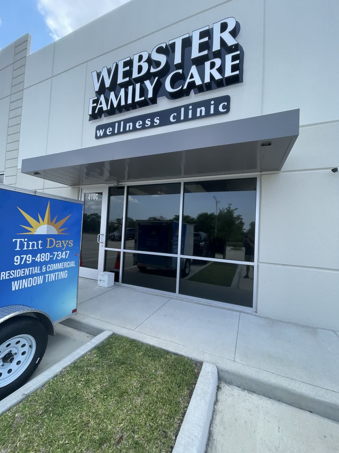 A clinic entrance with tinted glass