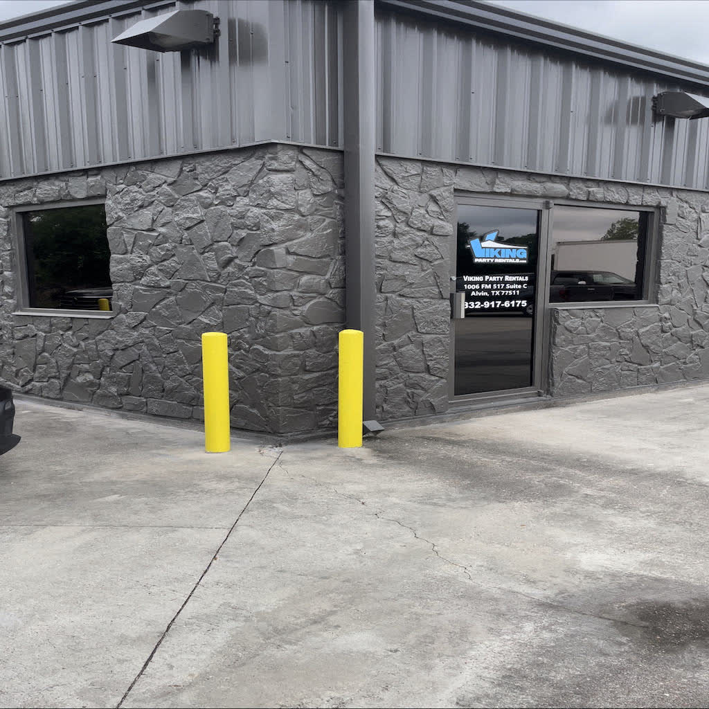 A stone-front commercial building in Alvin with tinted windows