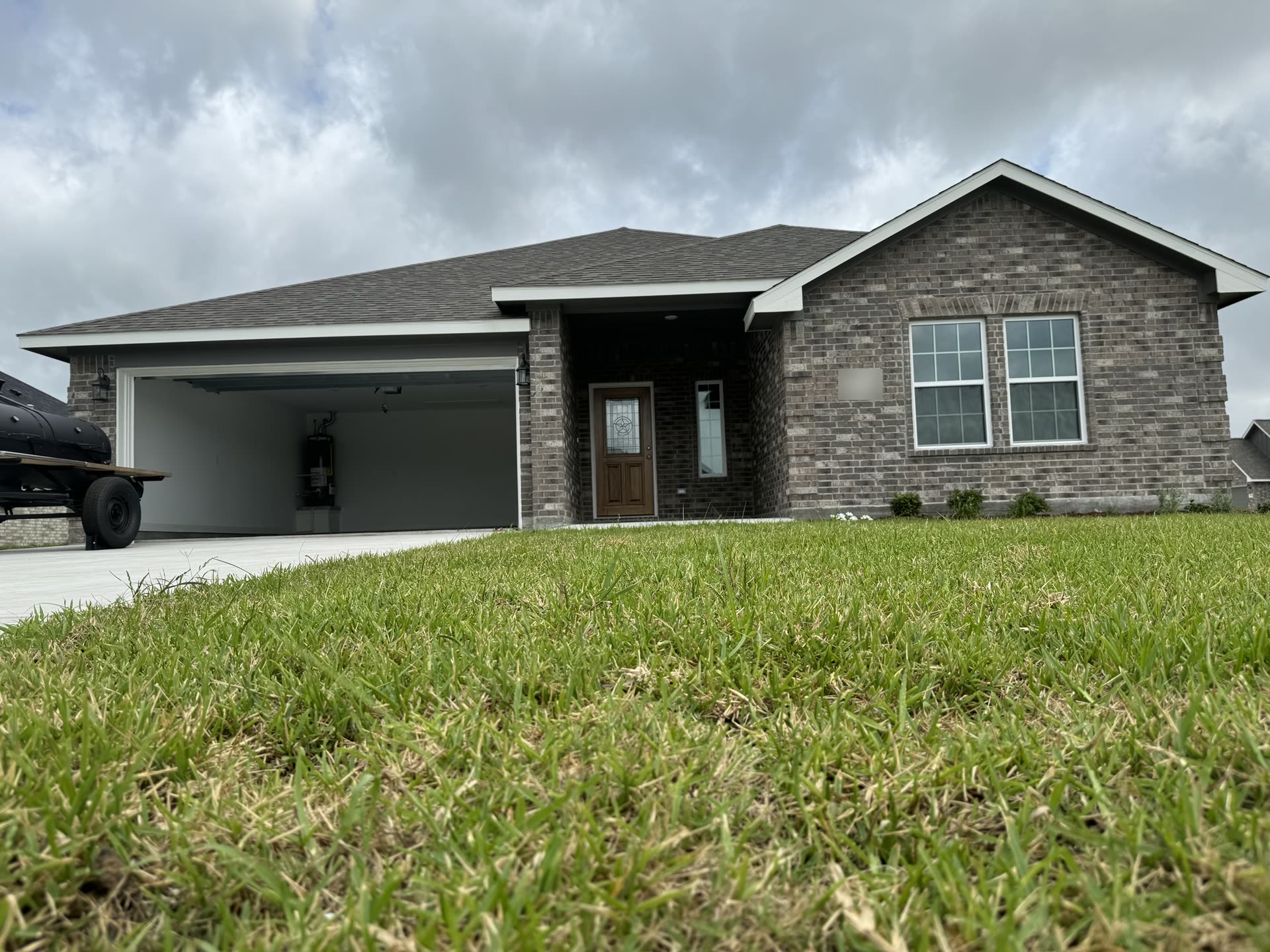 A brick home in Clute with tinted front windows